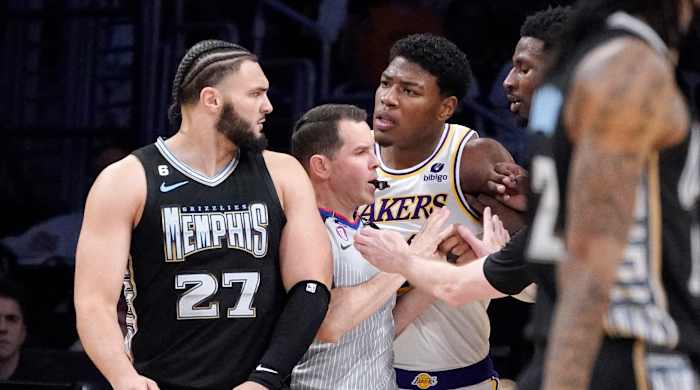 Rui Hachimura and Dillon Brooks clash.